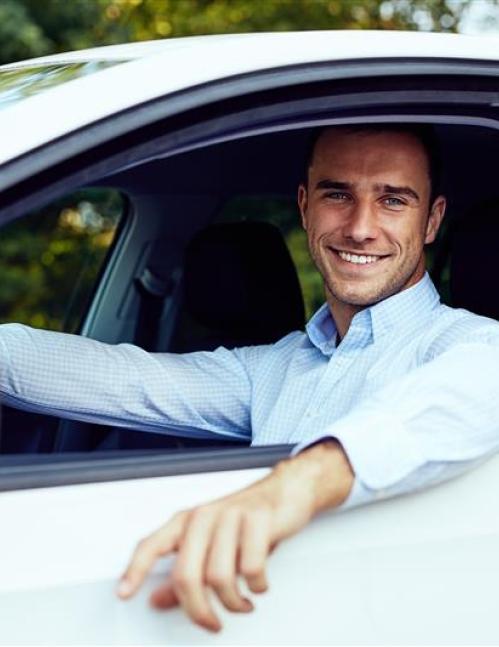 Happy man in car
