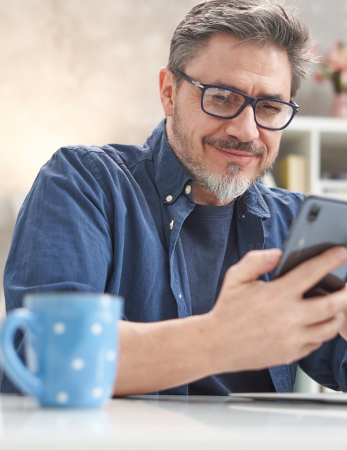 Man reviewing retirement apps on phone