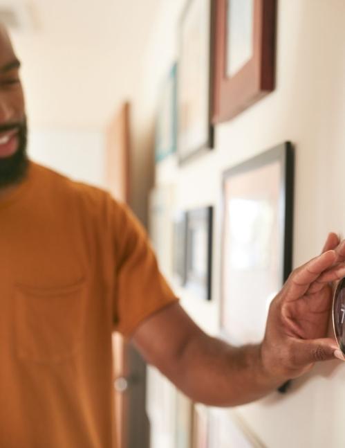 Man adjust home heating as JD Power reports household utilities rise in 2025 