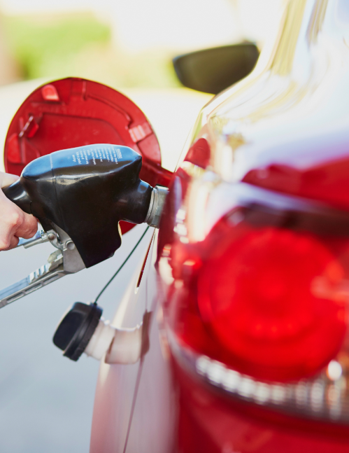 Person pumping gas as rising fuel prices adds affordability concerns in the JD Power Banking and Payments Intelligence Report.