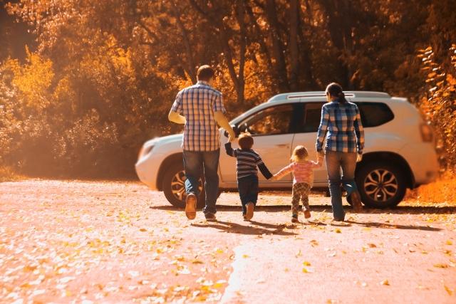 family running to car
