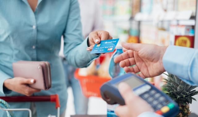 woman using credit card reader