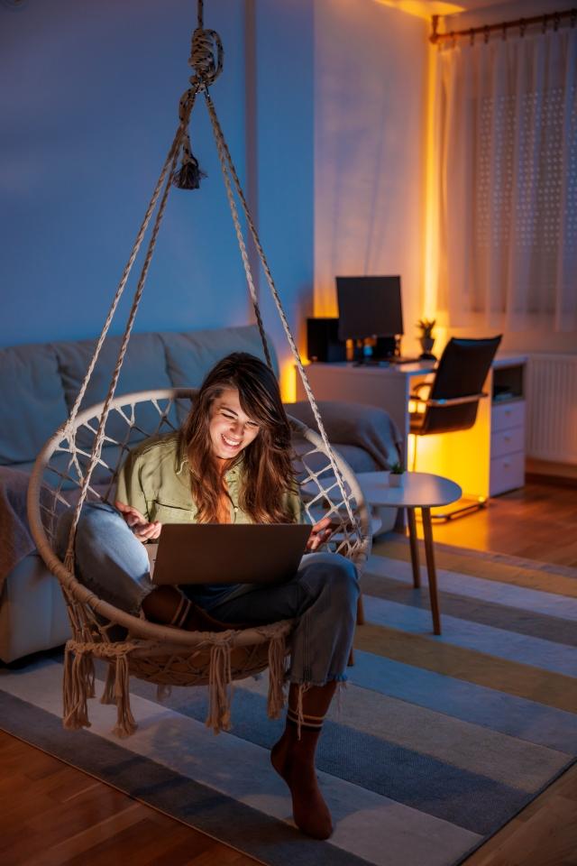 Woman on laptop lights on