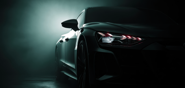 Vehicle in the dark with headlights on