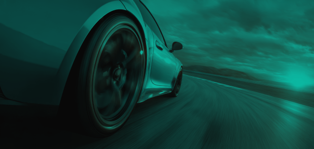 Vehicle driving off into the distance with a green hue