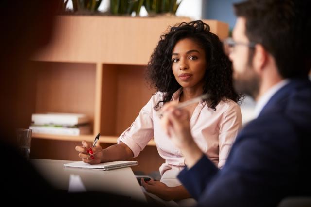 woman banker discussing the financial health and advice program from J.D. Power