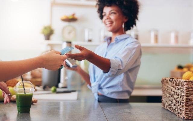 woman holding credit card for business cost