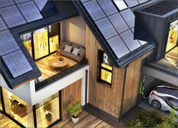 house with solar panels on roof, lit up at twilight