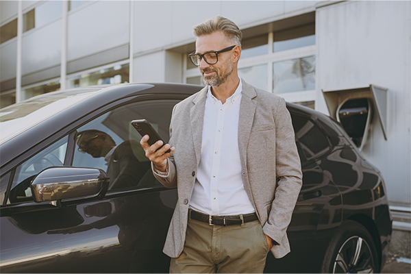 Happy Man Reviewing AutoFi Lender Mobile App