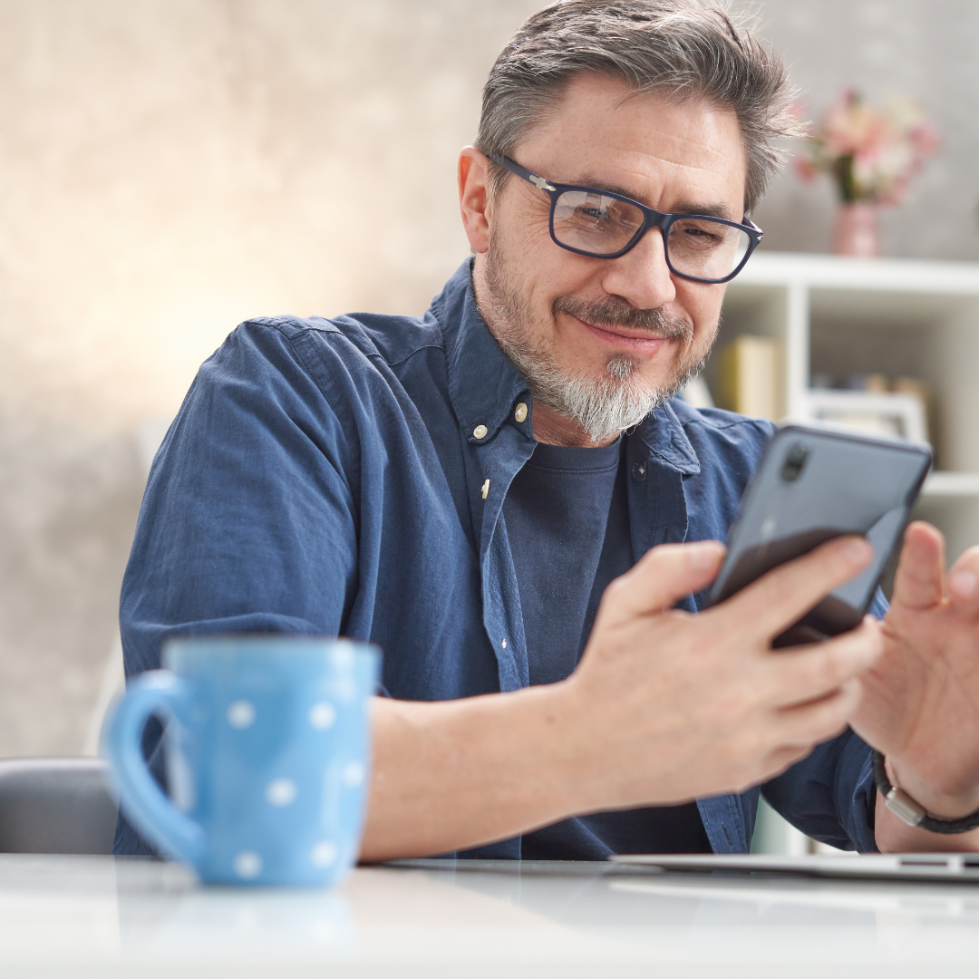 Man reviewing retirement apps on phone
