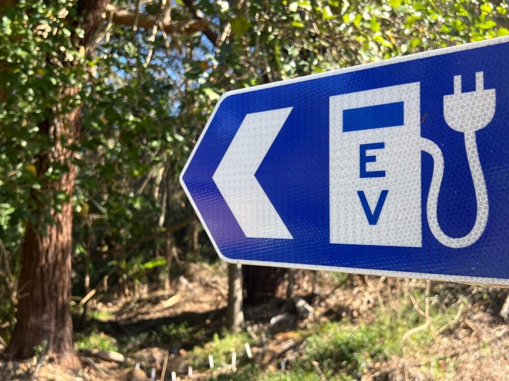 EV charging station traffic sign in a public parkland
