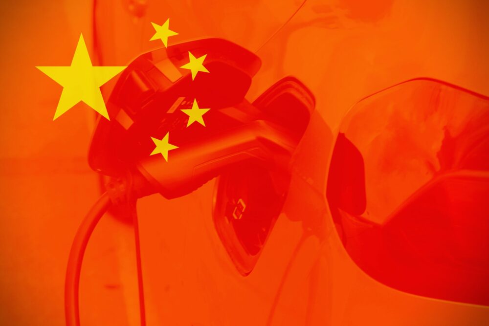China flags with cars as background