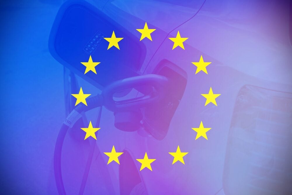 European flag with an electric car as background.|