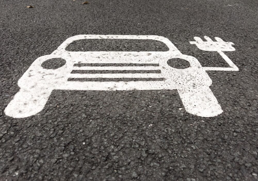 Electric Vehicle Charging Symbol Sign Painted on Asphalt