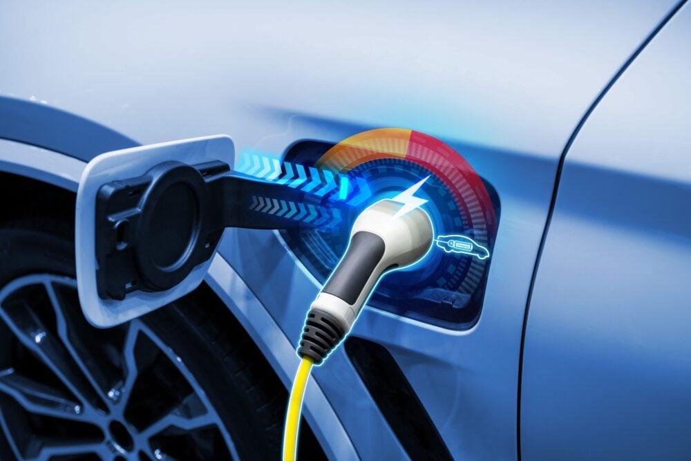 Power cable pump plug in charging power to electric vehicle EV car.||||||