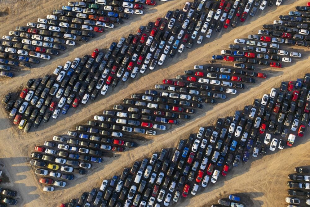 Aerial view of stockpiled used cars|