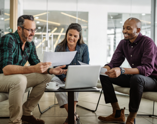 Business executives reviewing JD Power Deep Dive reports